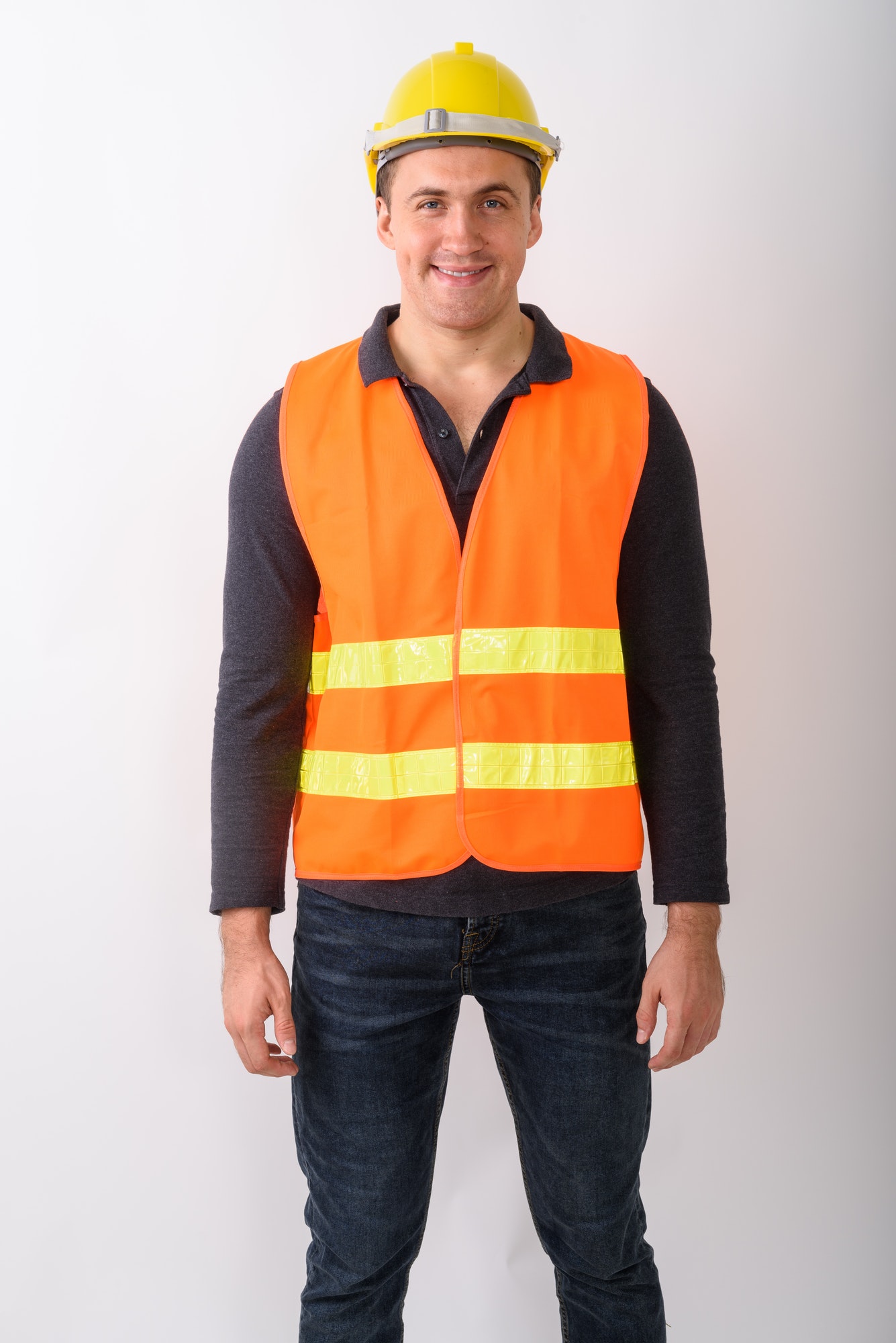Portrait of young man construction worker standing