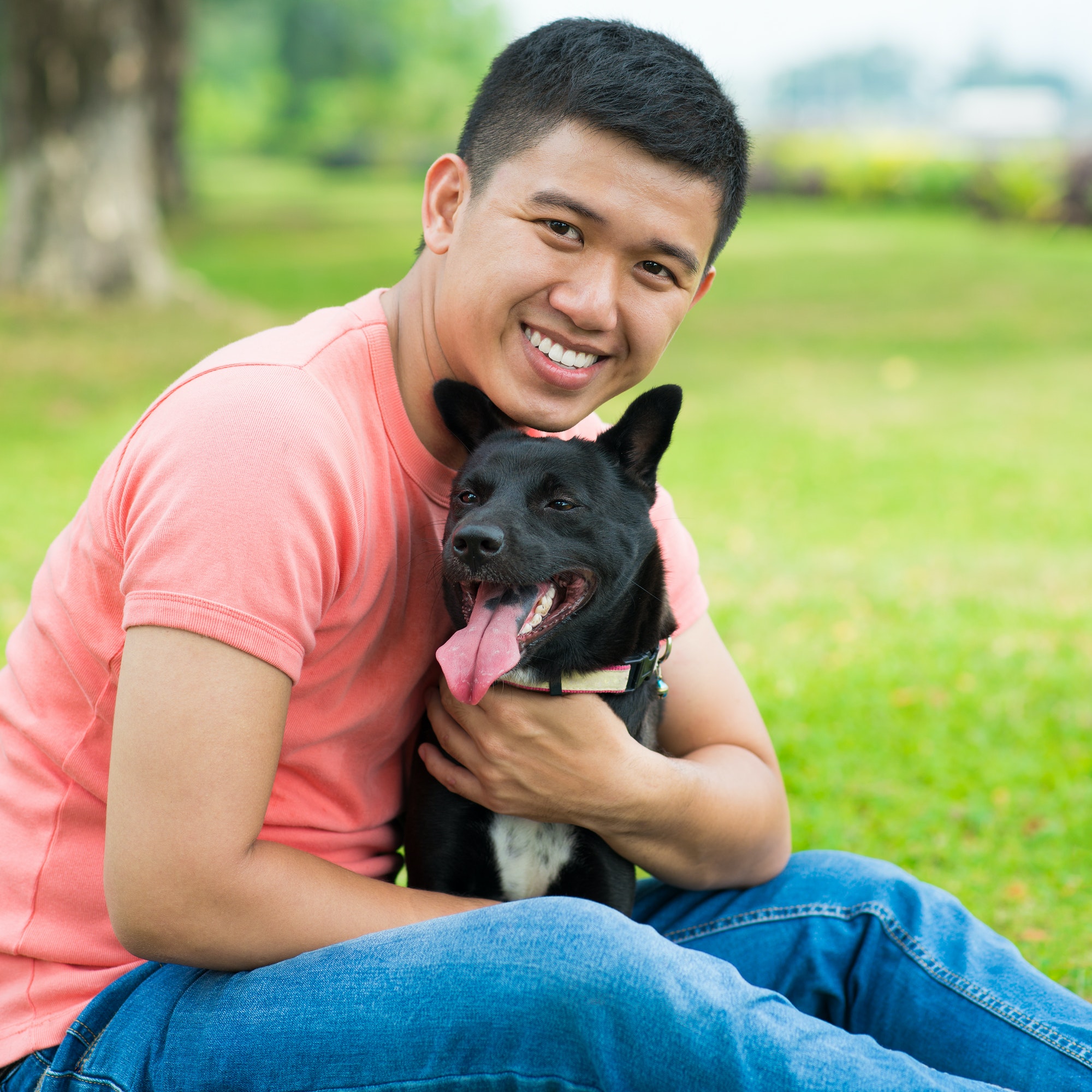 Asian man with his dog